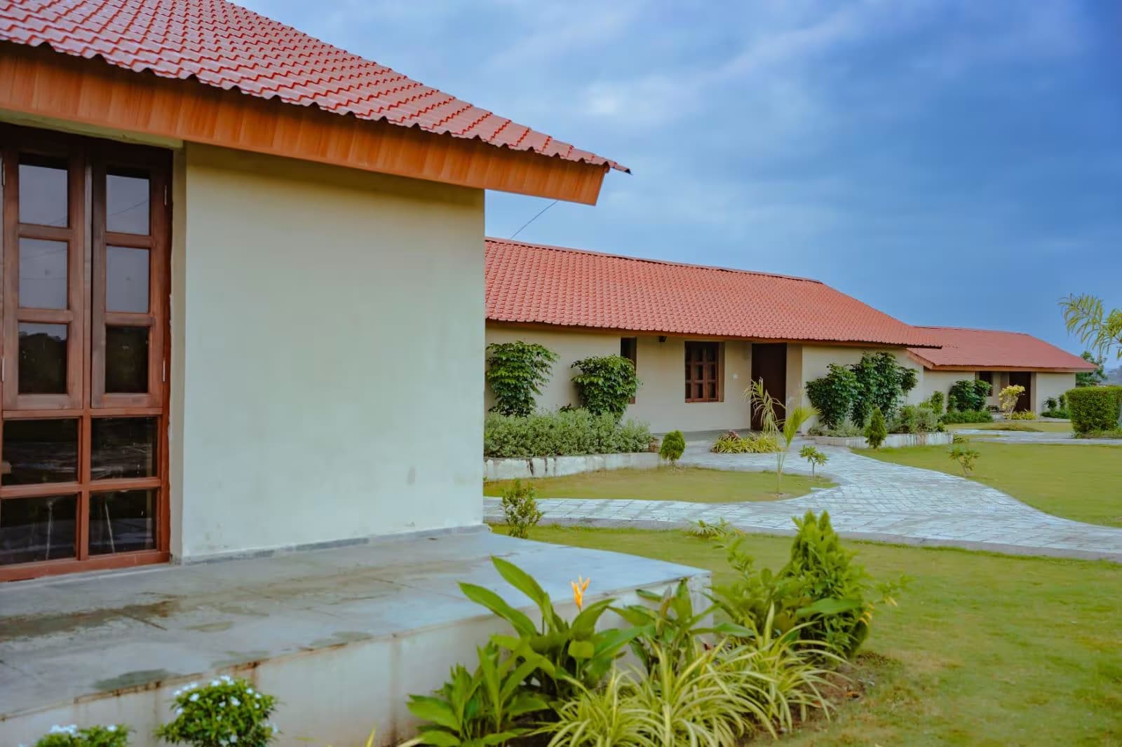 A limewashed cottage veranda with warm afternoon light
